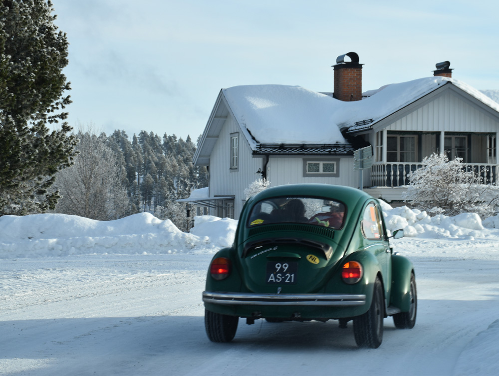Restored 1973 Volkswagen 1303S Super Beetle in silver parked on a quiet street