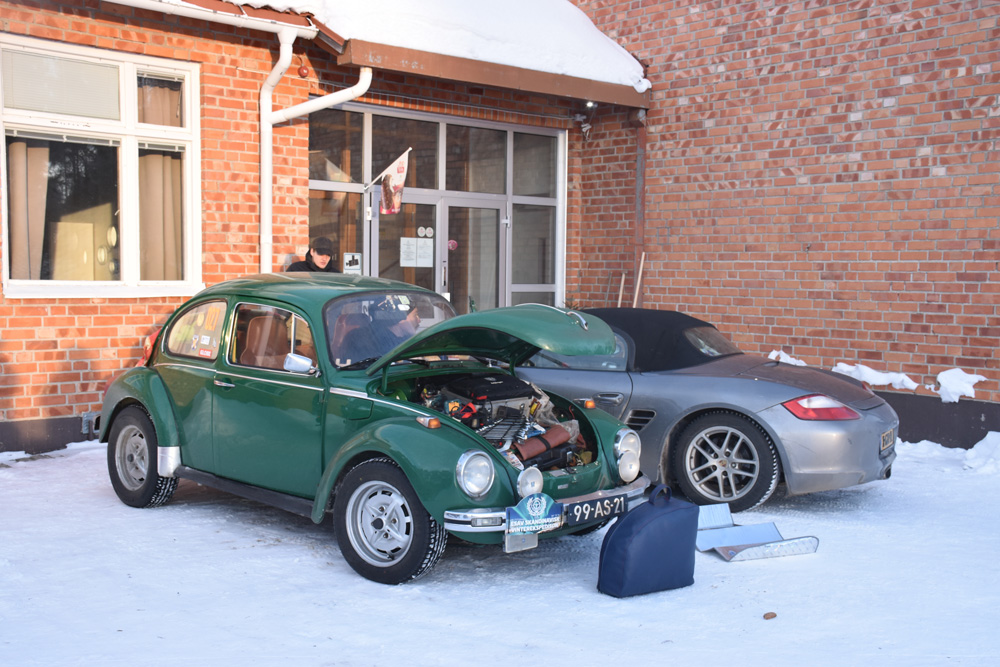 Close up of a 1303 Super Beetle front end showing the curved windshield and chrome bumper