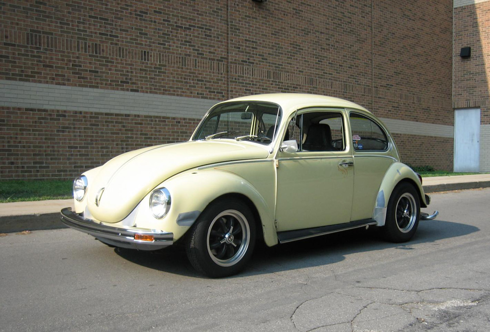 Vintage VW Beetle with knock off rims