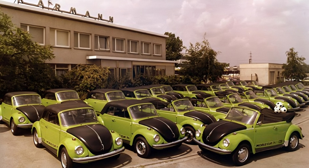 Rows of green World Cup 74 Super Beetle convertibles parked outside the Karmann factory in Osnabrück.