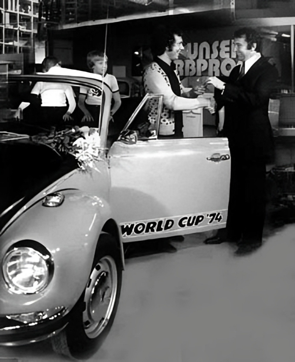 1974 World Cup Super Beetle convertible with World Cup '74 graphics being handed over at a Munich VW dealership